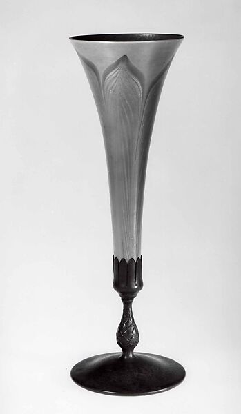 Tiffany Studios (1902–32), Transparent amber and green lead glass, cast and patinated bronze sten and foot. Blown, trailed, iridized., American, New York 