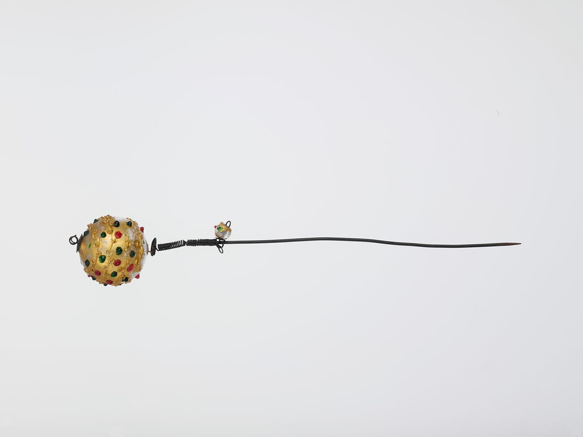 Hairpin, Lamp-worked colorless glass, gilt, wth clear trailed decoration and green and red "jewels," and copper wire., probably Italian (Venice); possibly Innsbruck 
