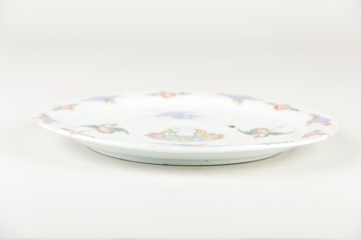 Plate with Buddhist monk Budai, Porcelain painted in underglaze cobalt blue and overglaze polychrome enamels (Jingdezhen ware), China