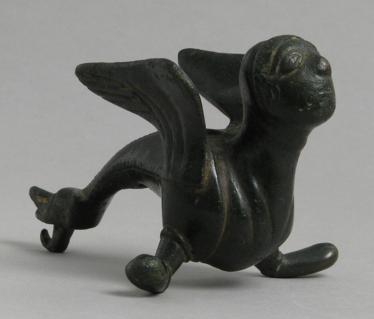 Fabulous Winged Creature with Human Face, probably from the foot of a candlestick, Copper alloy, South Netherlandish 