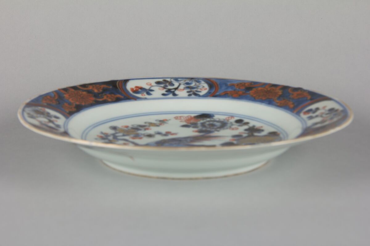 Plate with bird and flowers, Porcelain painted in underglaze blue and overglaze iron red, China