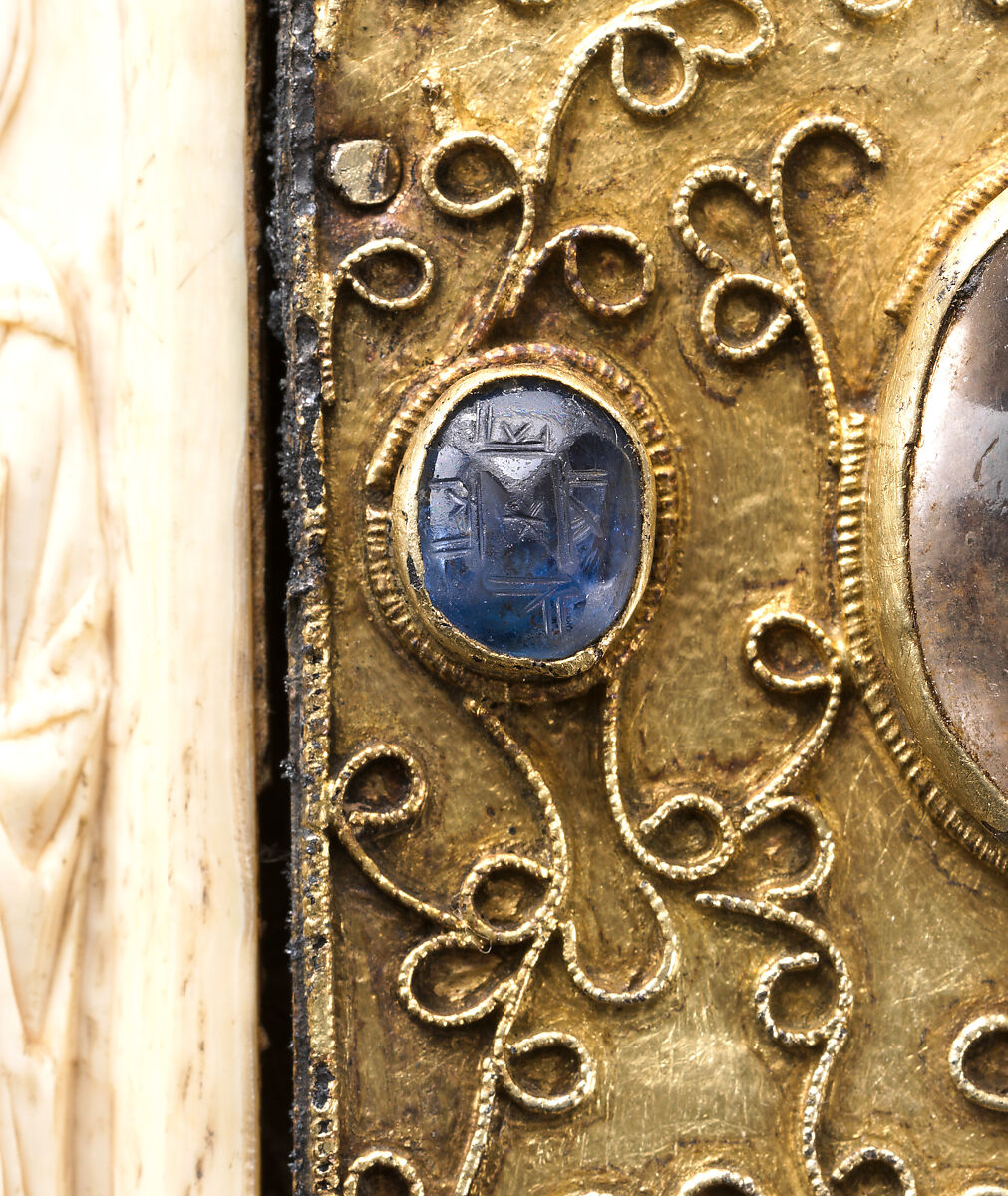 Panel with Byzantine Ivory Carving of the Crucifixion, Silver-gilt with pseudo-filigree, glass, crystal, and sapphire cabochons, ivory on wood support, Byzantine (ivory); Spanish (setting)