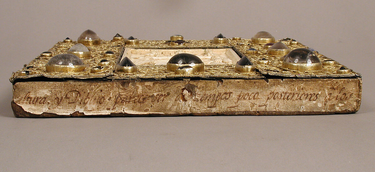 Panel with Byzantine Ivory Carving of the Crucifixion, Silver-gilt with pseudo-filigree, glass, crystal, and sapphire cabochons, ivory on wood support, Byzantine (ivory); Spanish (setting)