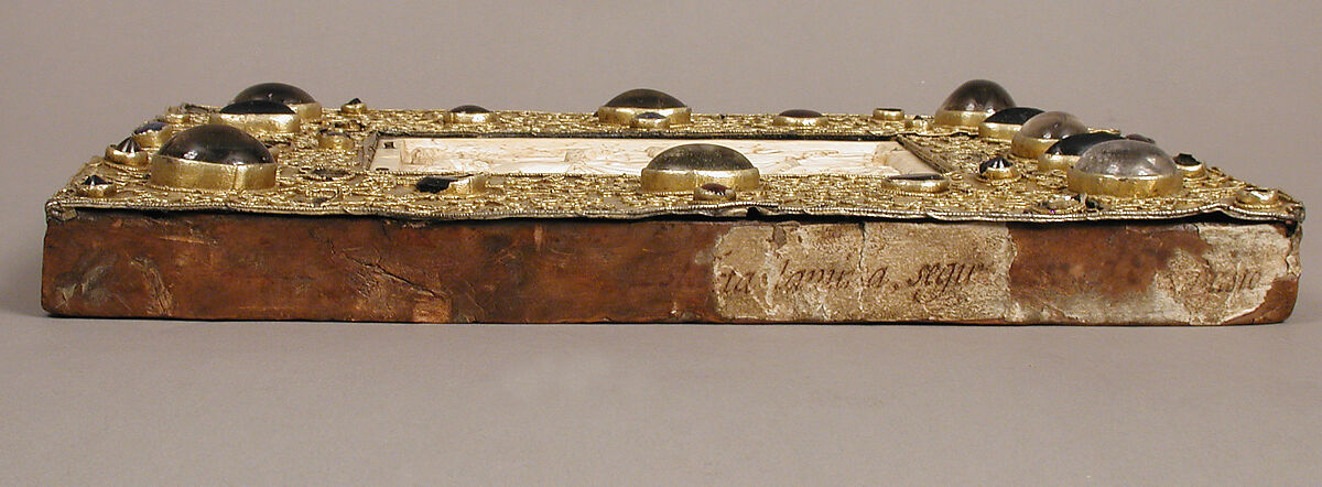 Panel with Byzantine Ivory Carving of the Crucifixion, Silver-gilt with pseudo-filigree, glass, crystal, and sapphire cabochons, ivory on wood support, Byzantine (ivory); Spanish (setting)