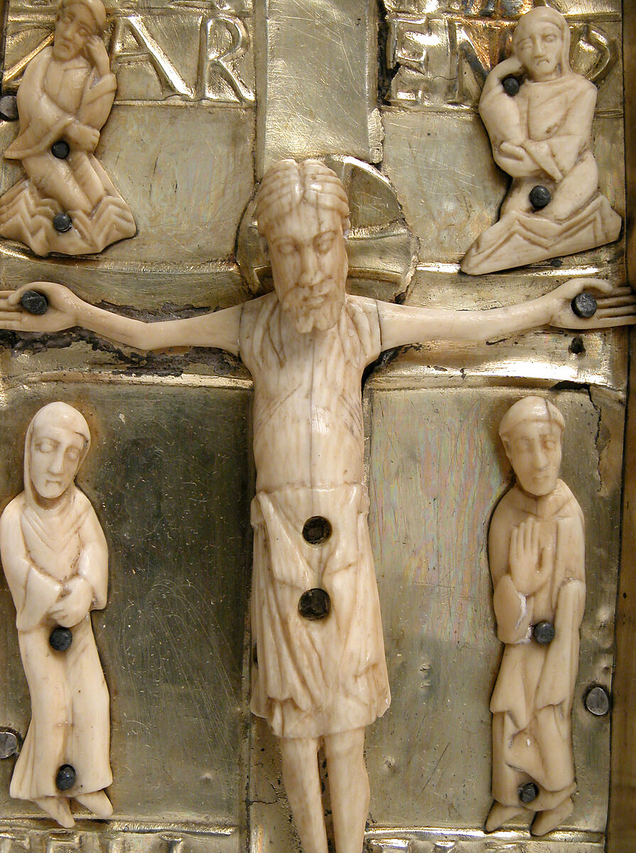 Panel with an Ivory Crucifixion Scene, Silver-gilt with pseudo-filigree, glass & stone cabochons, cloisonné enamel, elephant ivory with traces of gilding on pine support, Spanish