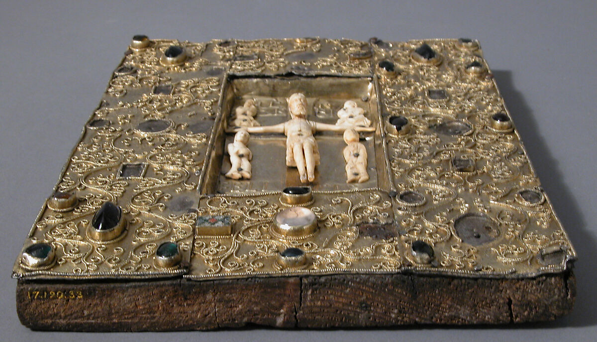 Panel with an Ivory Crucifixion Scene, Silver-gilt with pseudo-filigree, glass & stone cabochons, cloisonné enamel, elephant ivory with traces of gilding on pine support, Spanish
