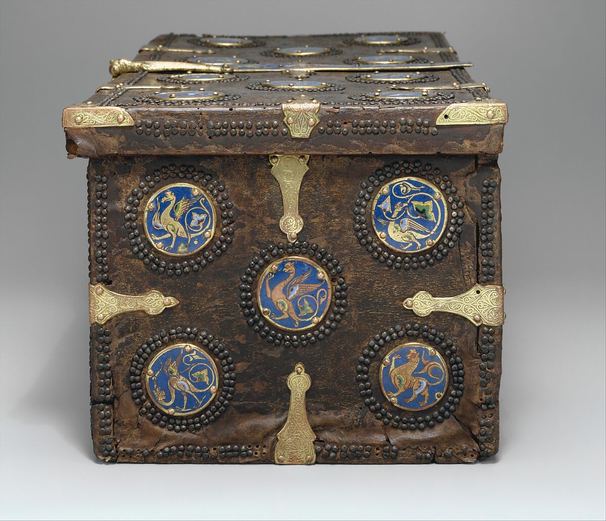 Coffret, Copper: engraved, stippled, and gilt; champlevé enamel: dark, medium, and light blue; green, yellow, red, and white; wood core with applied parchment, gesso; traces of red paint., French