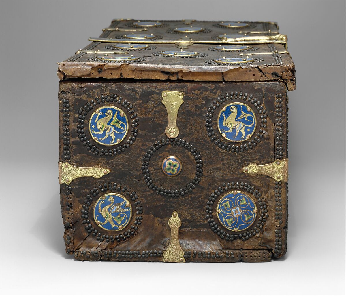 Coffret, Copper: engraved, stippled, and gilt; champlevé enamel: dark, medium, and light blue; green, yellow, red, and white; wood core with applied parchment, gesso; traces of red paint., French