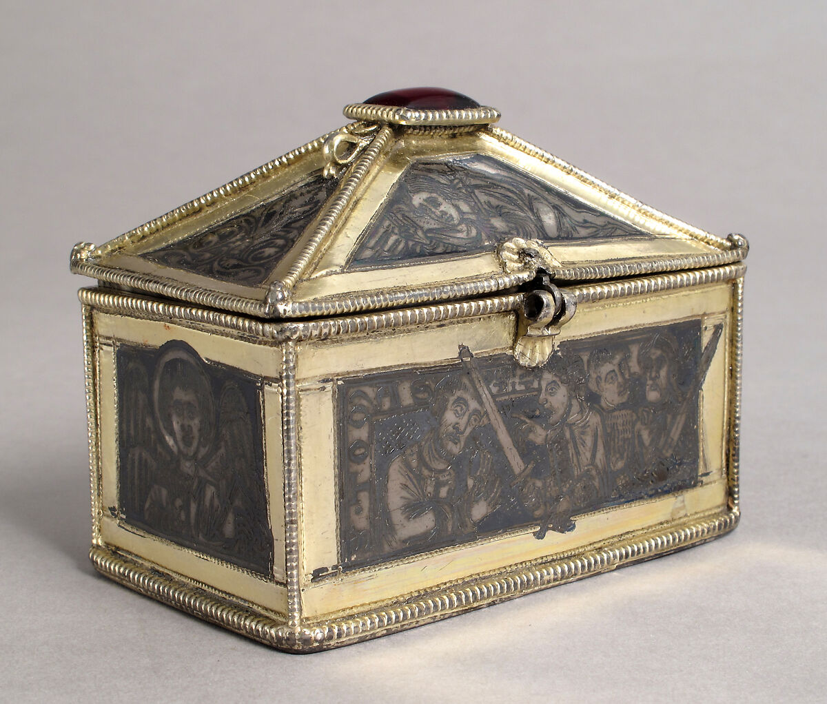 Reliquary Casket with Scenes from the Martyrdom of Saint Thomas Becket, Gilded silver with niello and a glass cabochon set over a tinted foil, British