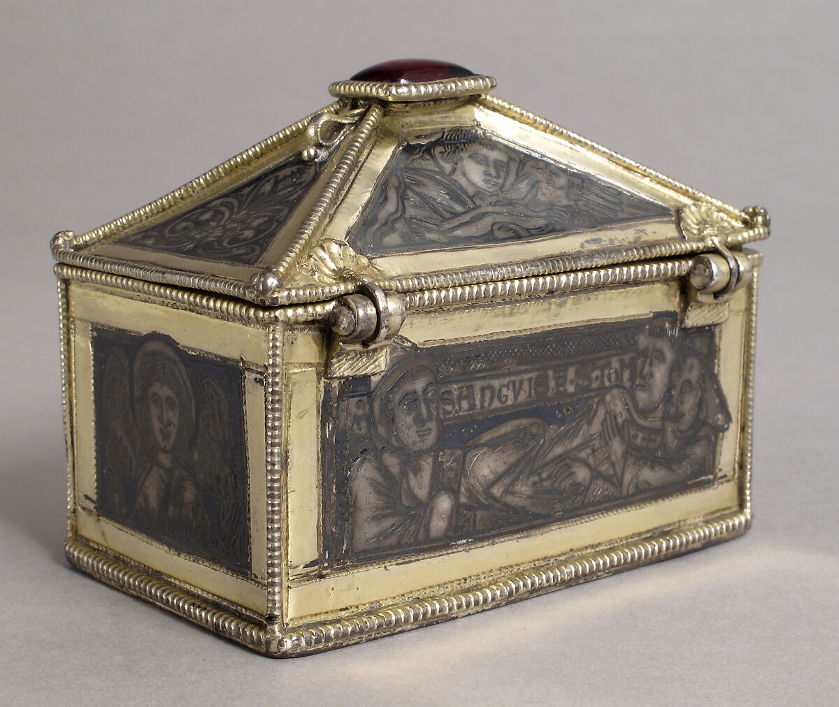 Reliquary Casket with Scenes from the Martyrdom of Saint Thomas Becket, Gilded silver with niello and a glass cabochon set over a tinted foil, British