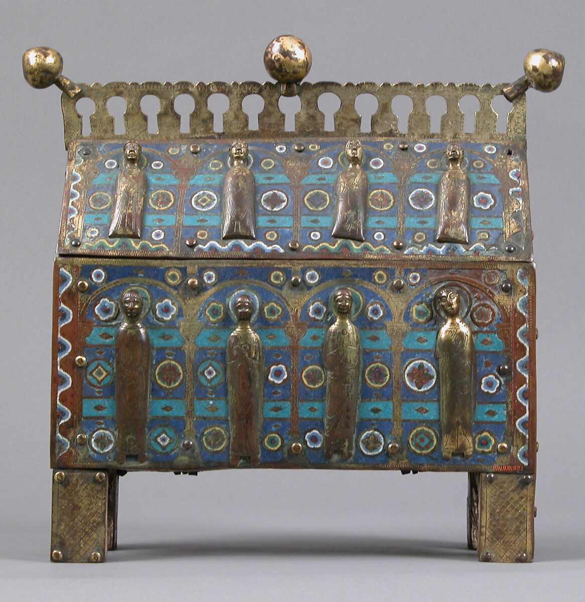 Chasse, Copper-gilt and champlevé enamel. Front: eight repoussé figures applied and gilt; each end: figure chased and gilt; black: blue ground, intersecting turquoise bands, fleurons in bright colors; crest and feet chased and gilt., French