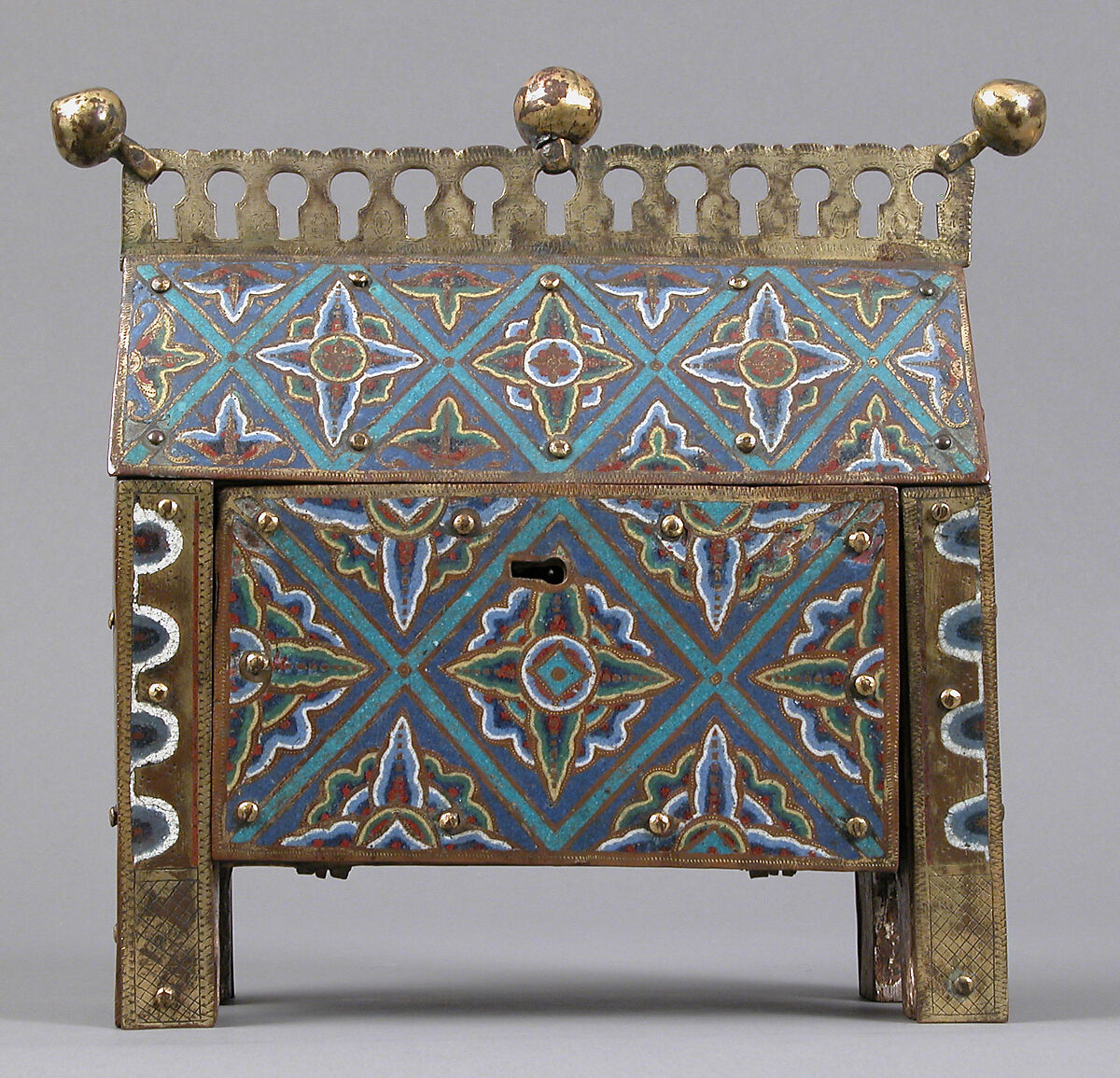 Chasse, Copper-gilt and champlevé enamel. Front: eight repoussé figures applied and gilt; each end: figure chased and gilt; black: blue ground, intersecting turquoise bands, fleurons in bright colors; crest and feet chased and gilt., French