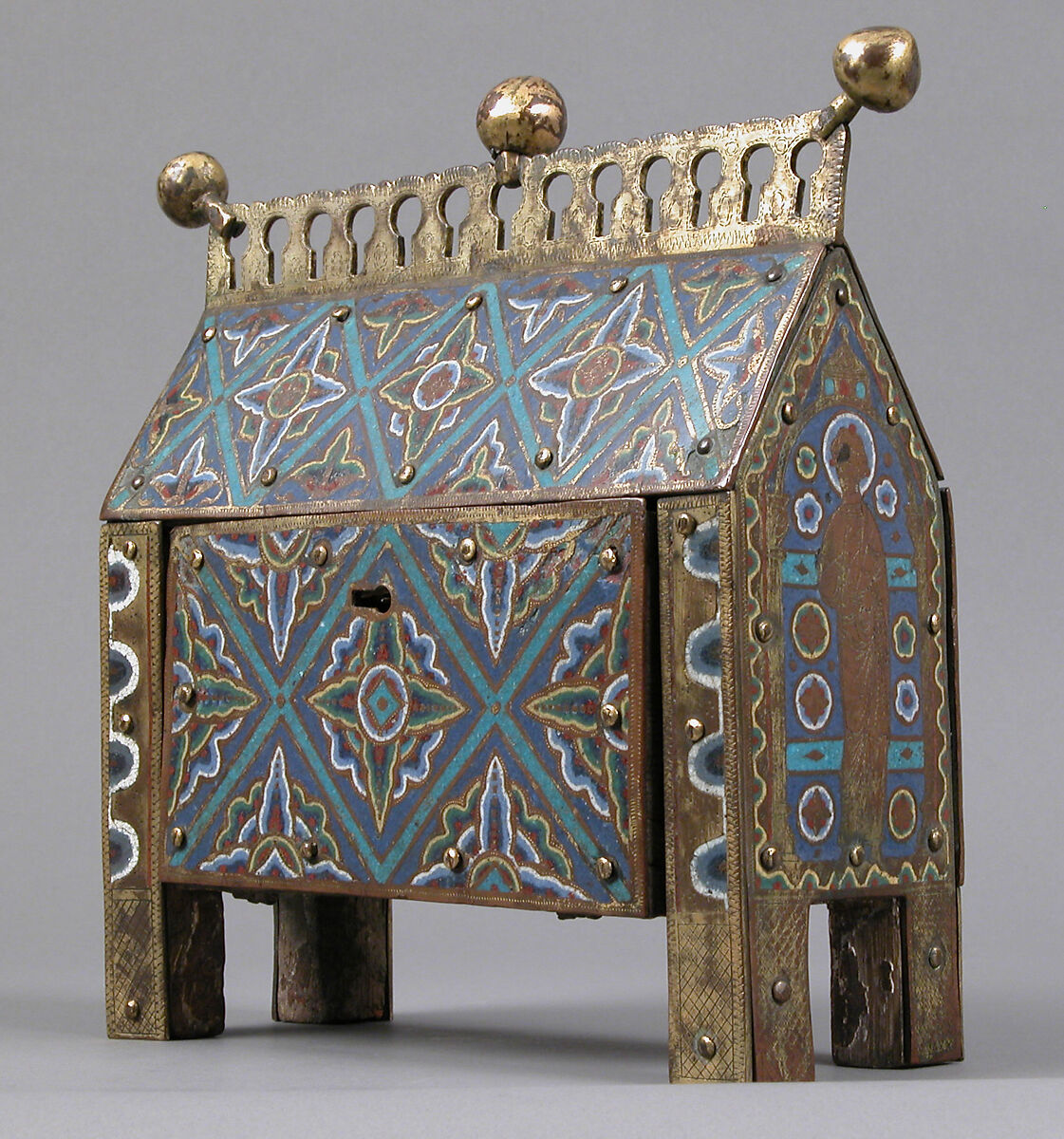 Chasse, Copper-gilt and champlevé enamel. Front: eight repoussé figures applied and gilt; each end: figure chased and gilt; black: blue ground, intersecting turquoise bands, fleurons in bright colors; crest and feet chased and gilt., French