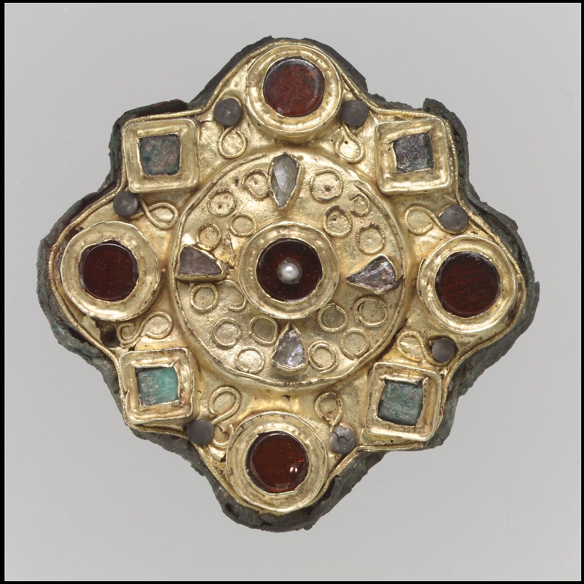 Disk Brooch, Gold sheet, filigree, garnets with patterned foil backings, Frankish