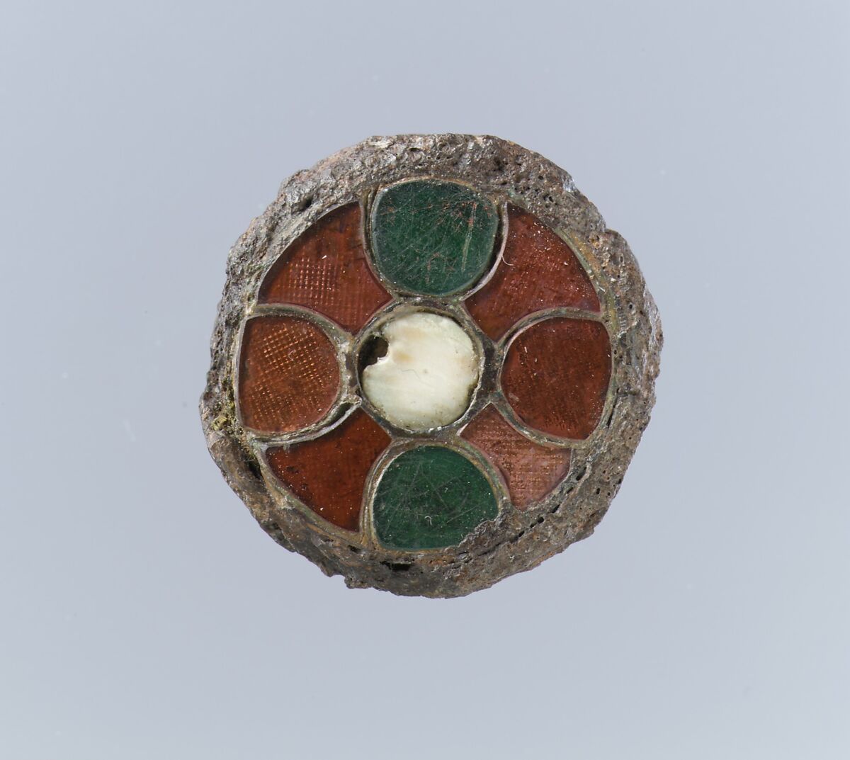 Disk Brooch, Copper alloy, garnets, green glass, with patterned foil backings..., Frankish 