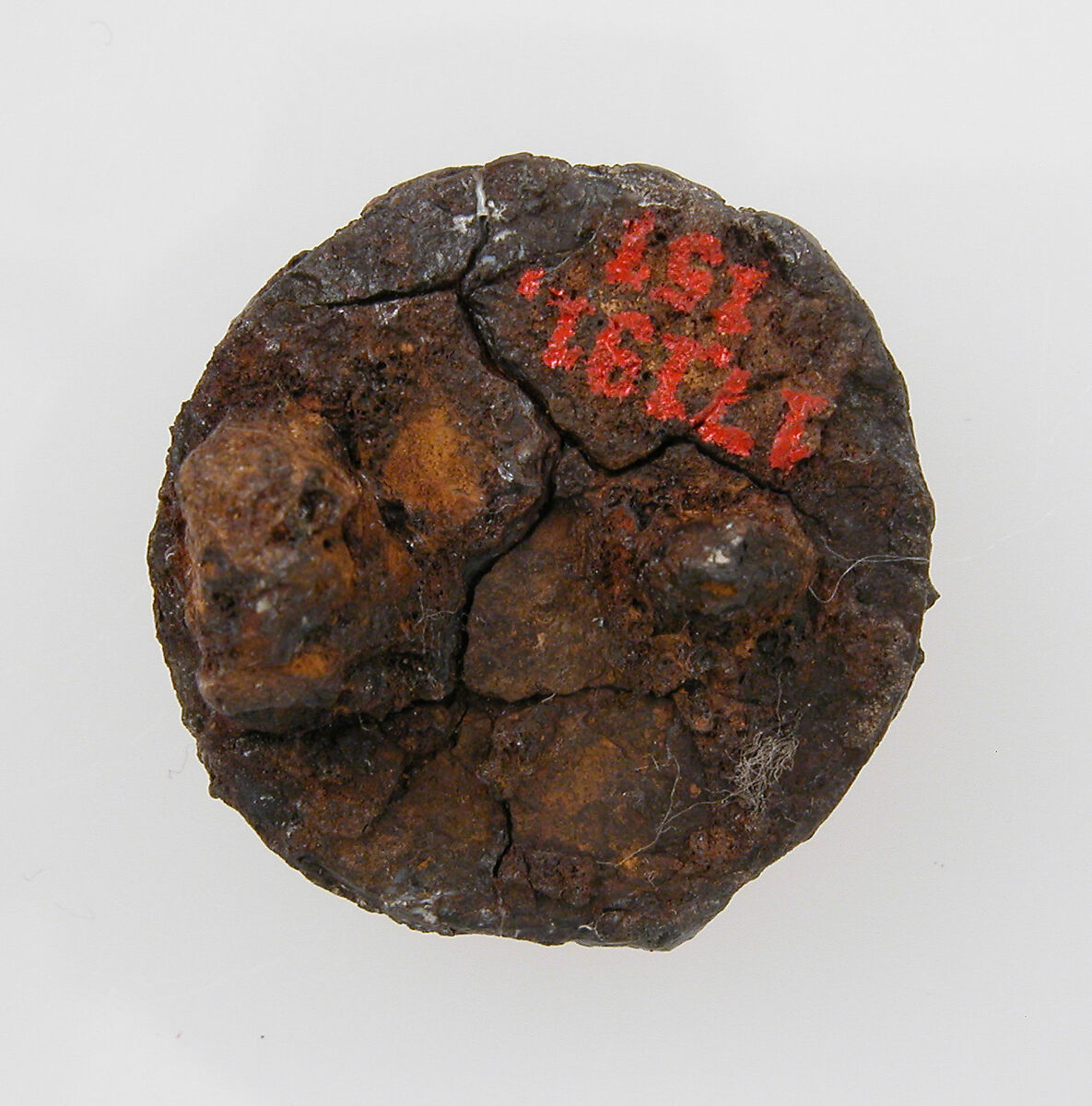 Disk Brooch, Silver over iron core, garnet or glass paste, gold foil, Frankish