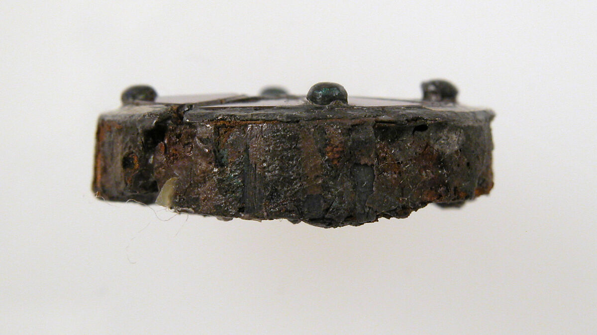 Disk Brooch, GIlded silver, paste or garnet, iron core, and metal foil, Frankish