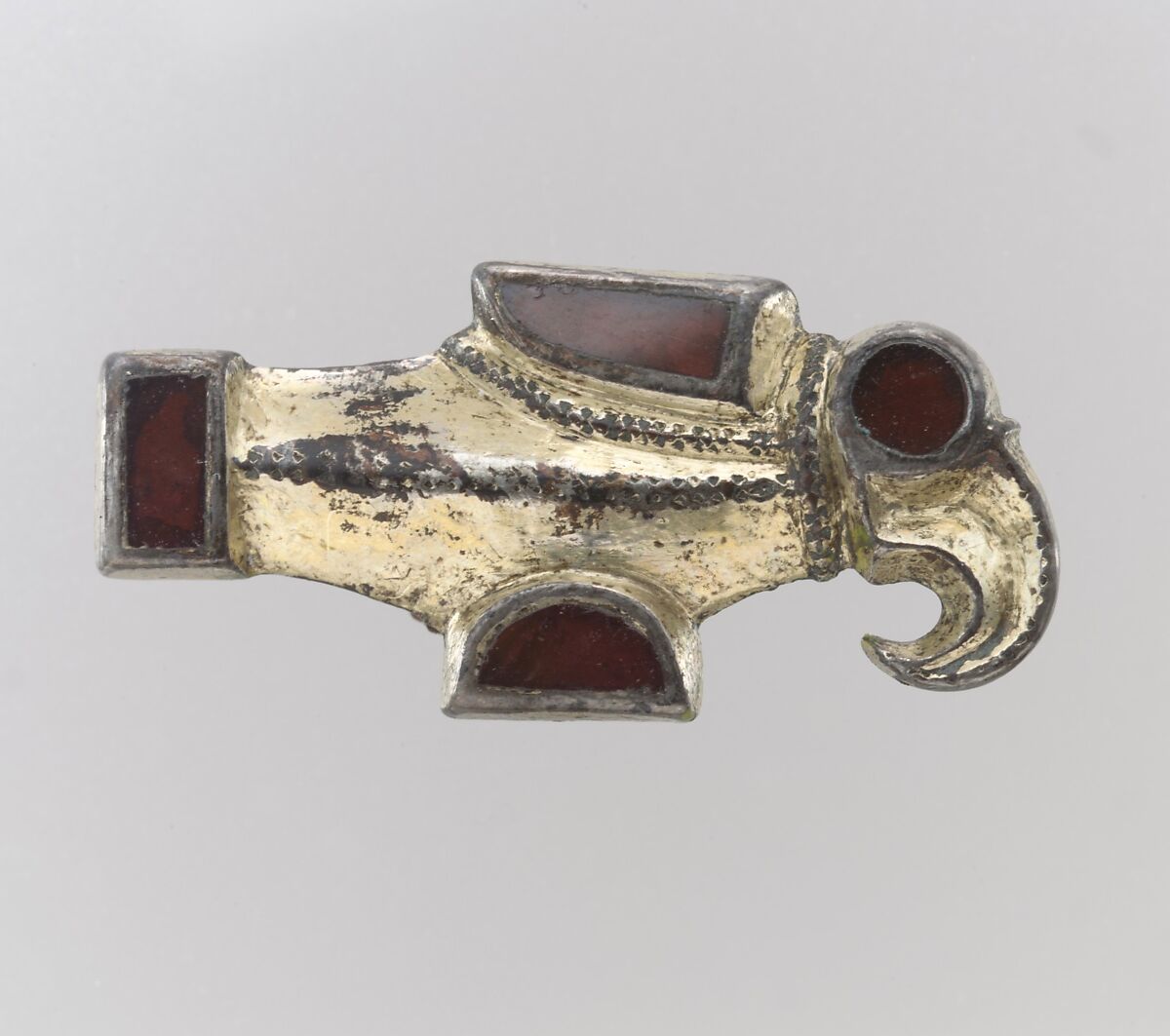 Bird-Shaped Brooch, Silver-gilt, garnets, foil backings for garnets; iron spring, Frankish 