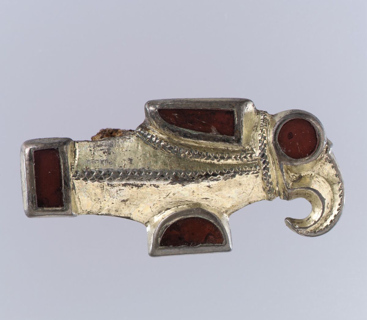 Bird-Shaped Brooch, Silver-gilt, garnets, foil backings for garnets; iron spring, Frankish 