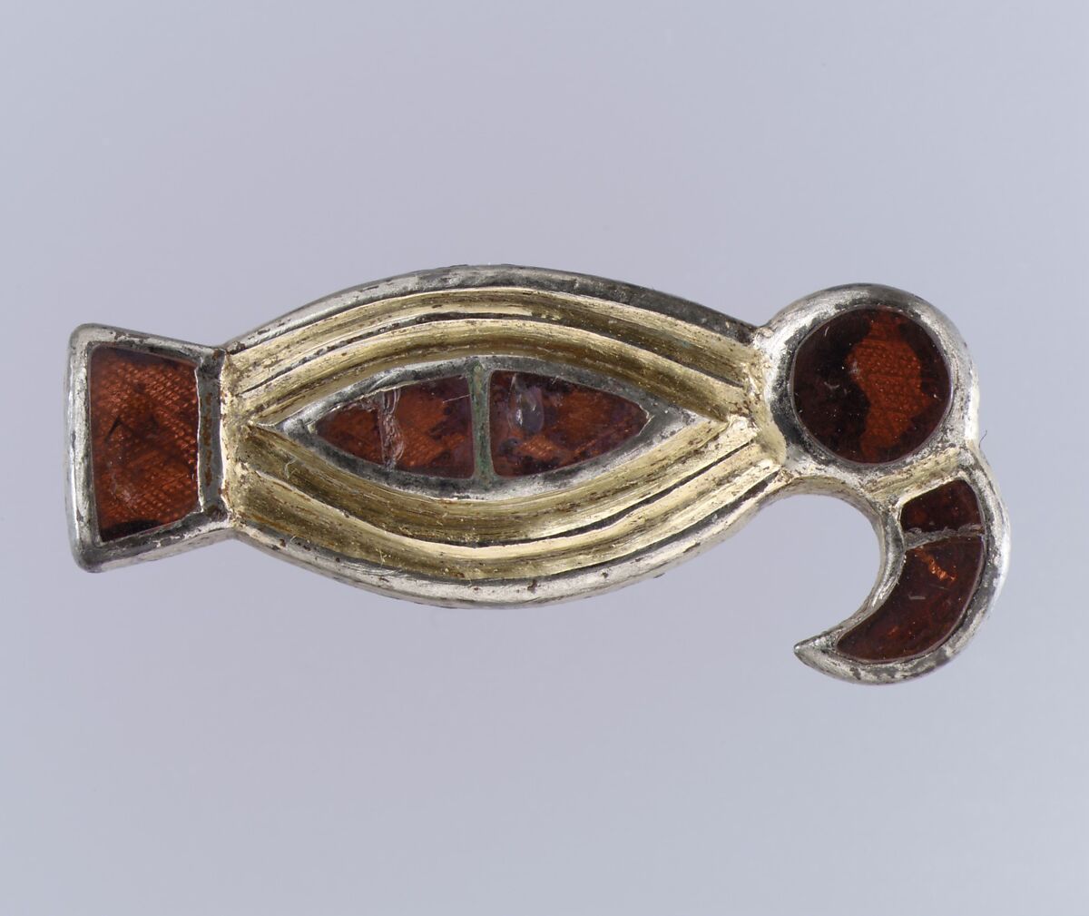 Bird-Shaped Brooch, Silver-gilt, garnets with patterned foil backings, Frankish 