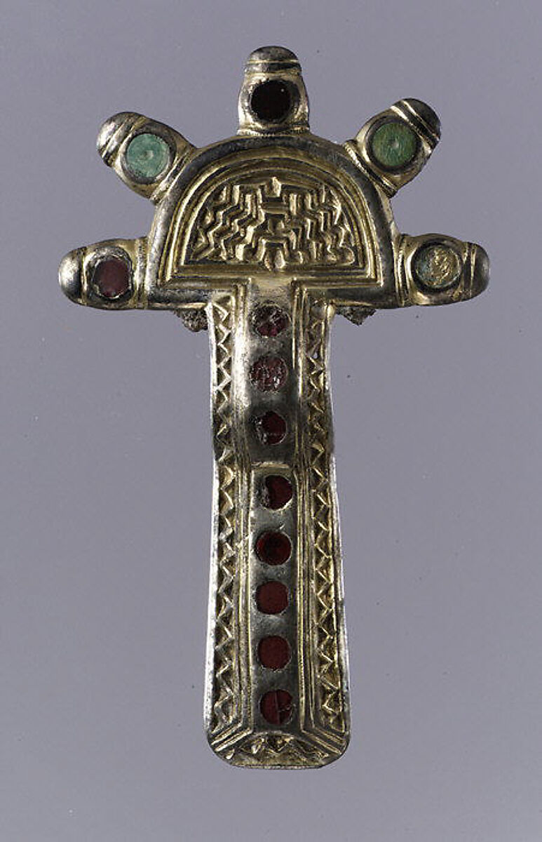 Bow Brooch, Silver, gilt and cast; garnet with unpatterned foil backing; bone; iron spring/pin, Frankish 