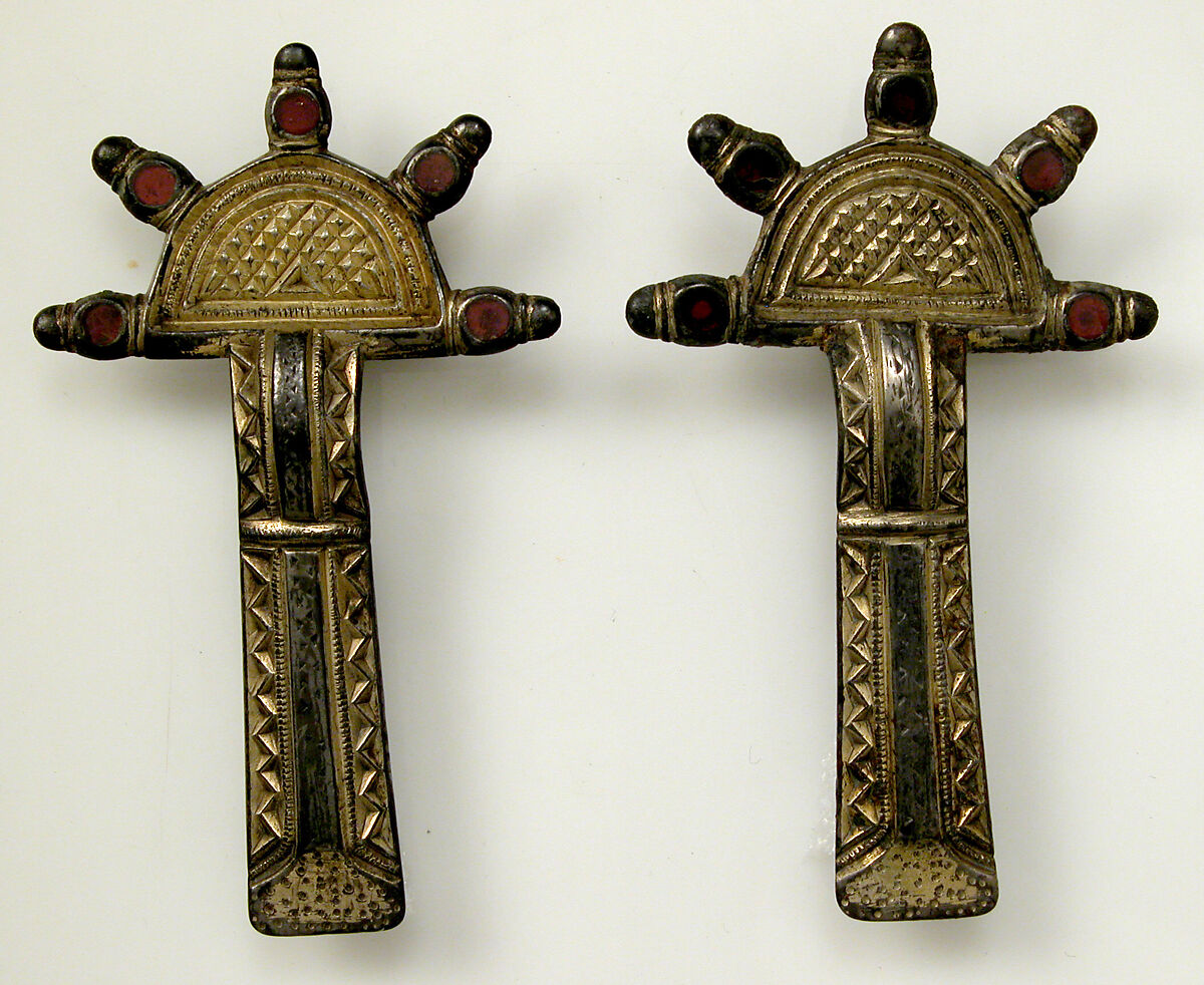 Bow Brooch, Silver-gilt, niello, garnet, iron pin, Frankish