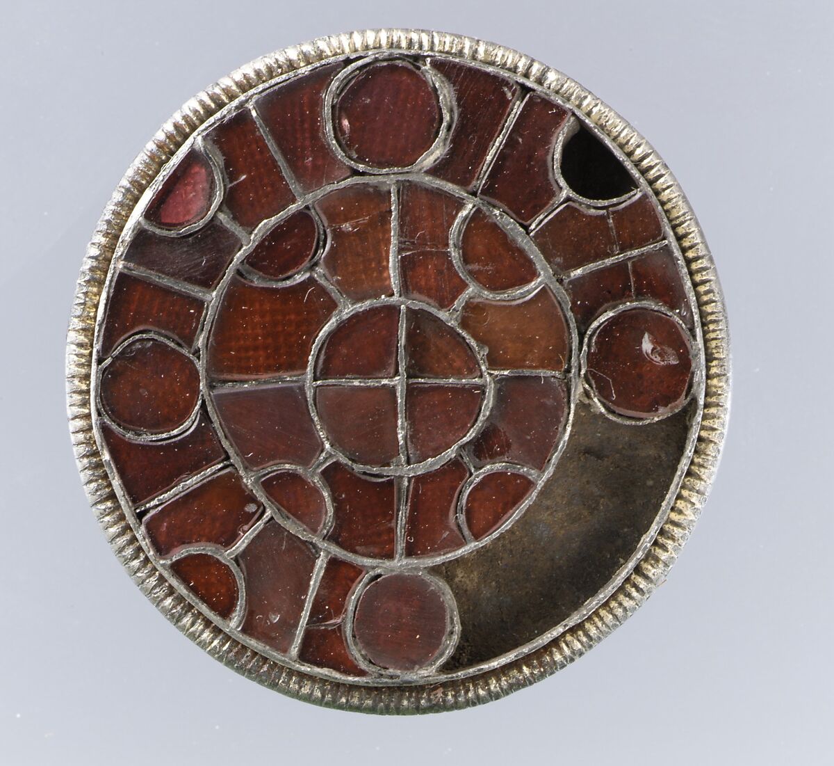 Disk Brooch, Silver-gilt, garnets with patterned foil backings., Frankish 