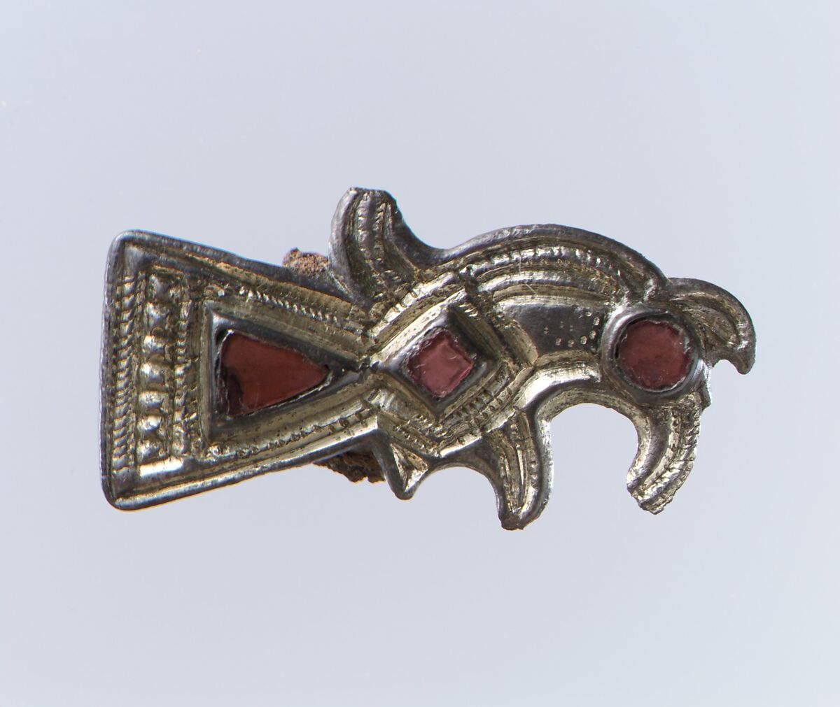 Bird-Shaped Brooch, Silver-gilt, garnets with patterned foil backings; iron spring/pin, Frankish 