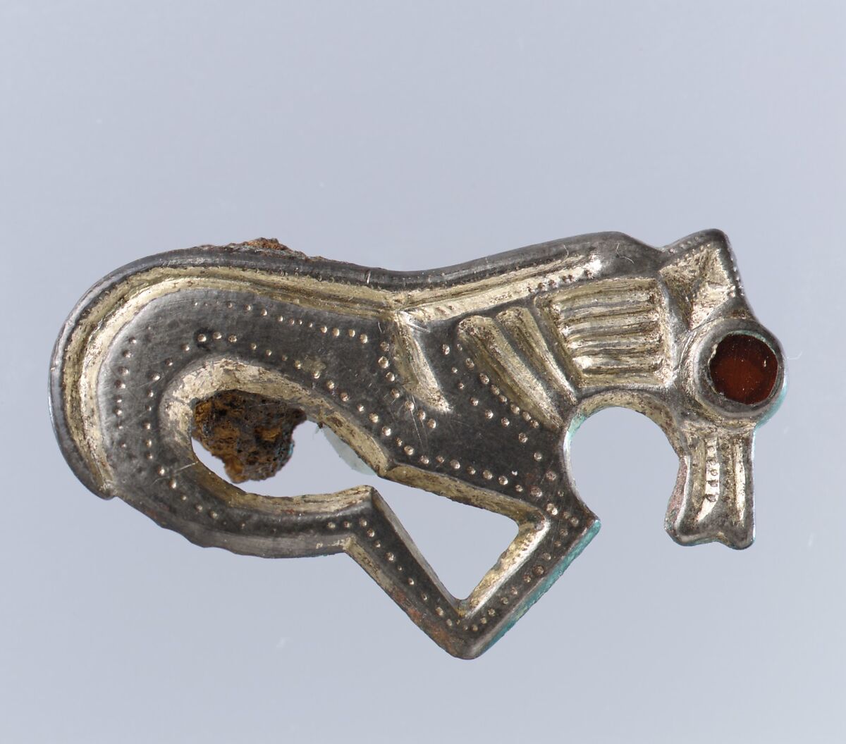 Horse-Shaped  Brooch, Silver-gilt, garnet with foil backing(?); iron spring, Frankish 
