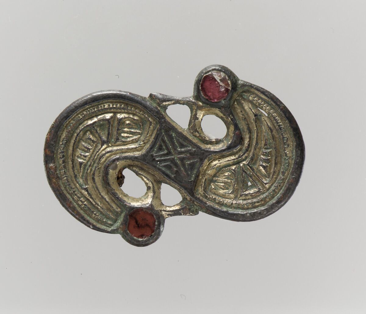 S-Shaped Brooch, Silver-cast relief and settings; chased, punched; niello inlay; garnets, gilt., Frankish 