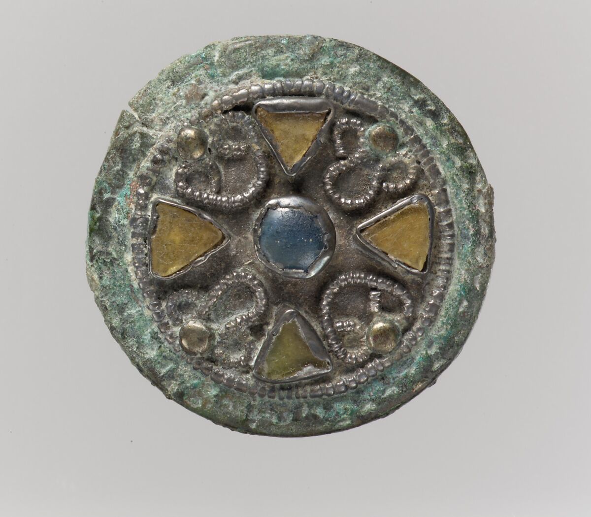 Disk Brooch, Silver-gilt, blue and pale amber glass, copper alloy support (gilt?), Frankish 