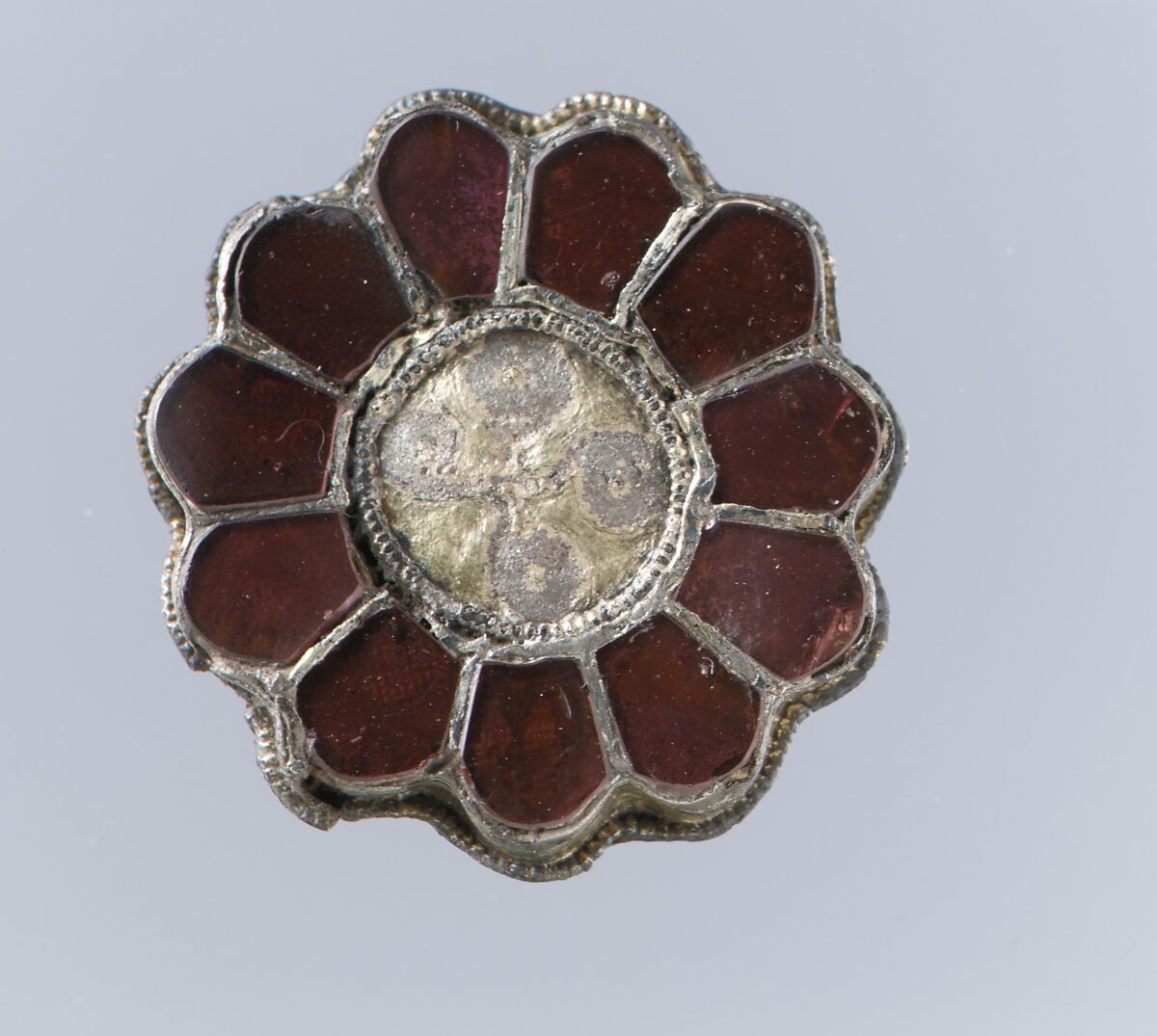 Rosette Brooch, Silver-gilt, garnets with patterned foil backings, Gilded silver with garnets, glass, and pearl, Frankish 