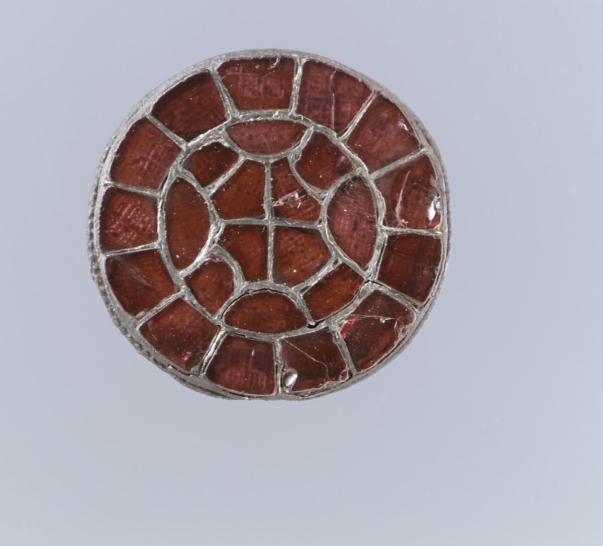 Disk Brooch, Silver-gilt, garnets with patterned foil backings, and pearl, Frankish 