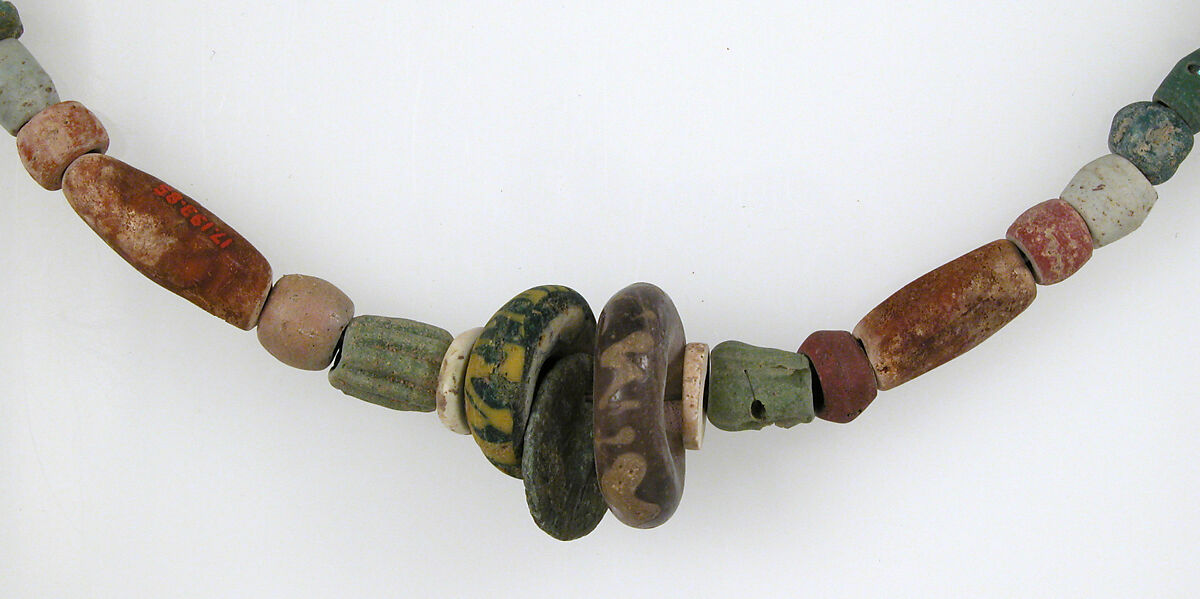 Beaded Necklace, Glass, stone, shell, amber,  3 copper alloy coins,, Frankish