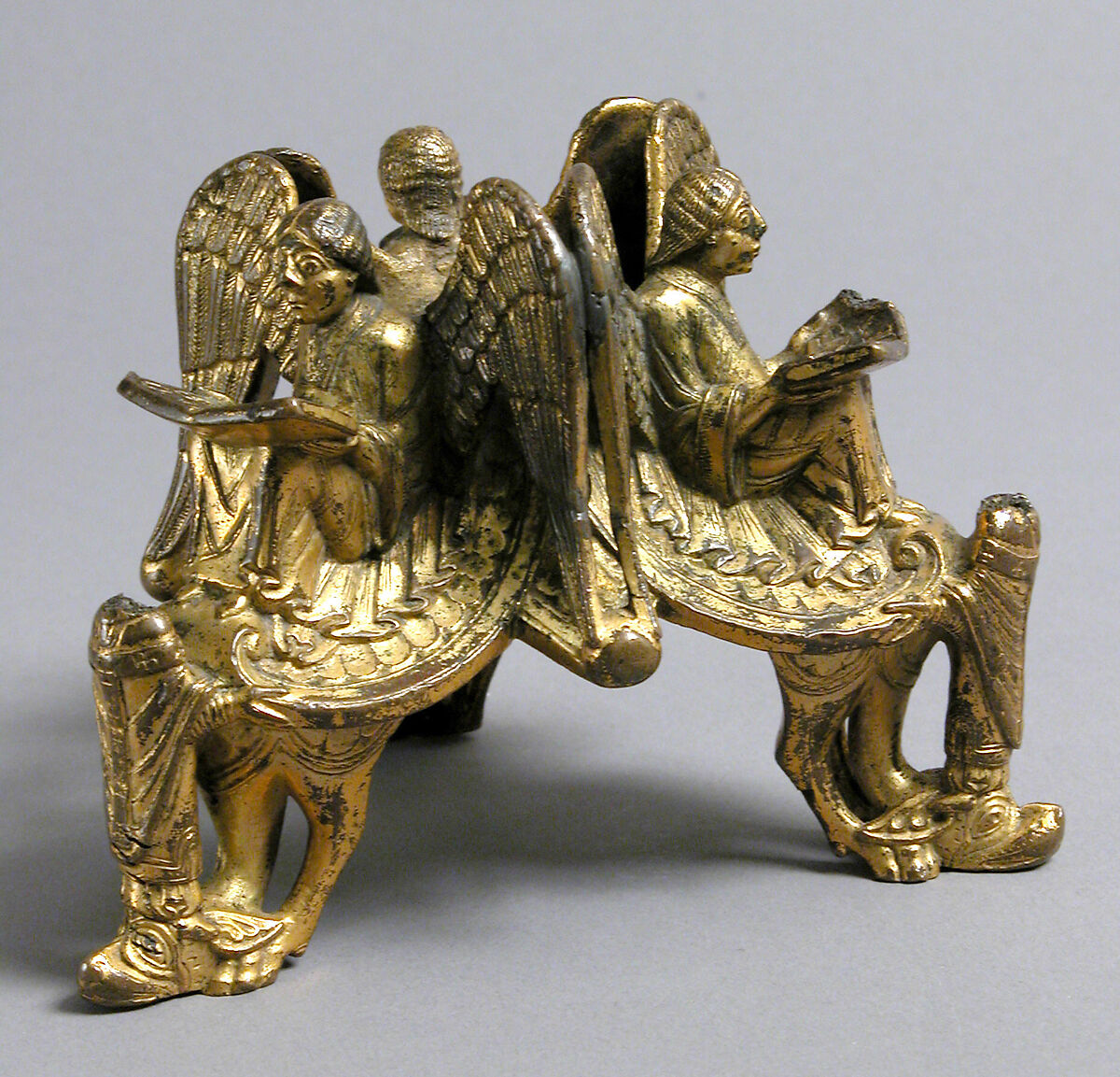 Base of an Altar Cross with Reading Angels Sitting on Dragons and Standing Church Fathers, Copper alloy, cast and gilt, North Italian