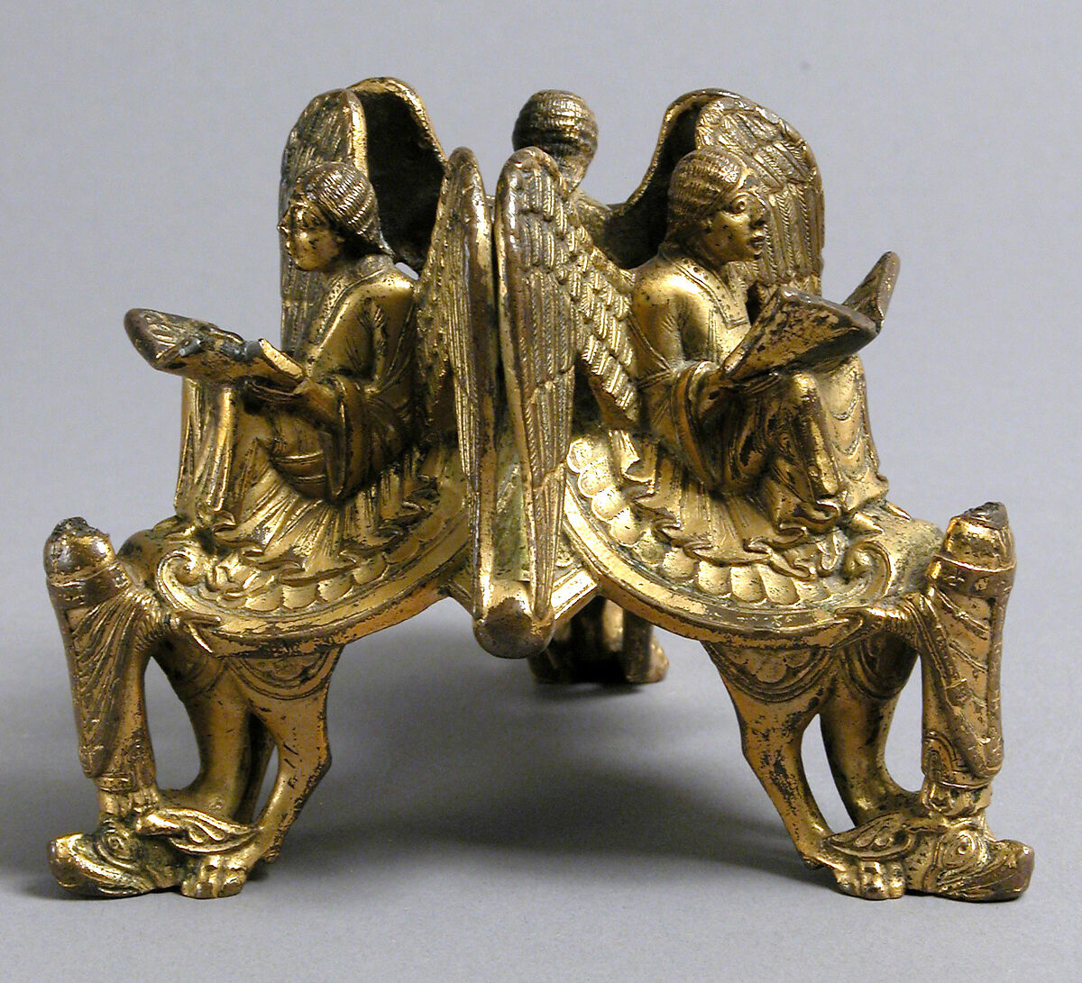 Base of an Altar Cross with Reading Angels Sitting on Dragons and Standing Church Fathers, Copper alloy, cast and gilt, North Italian