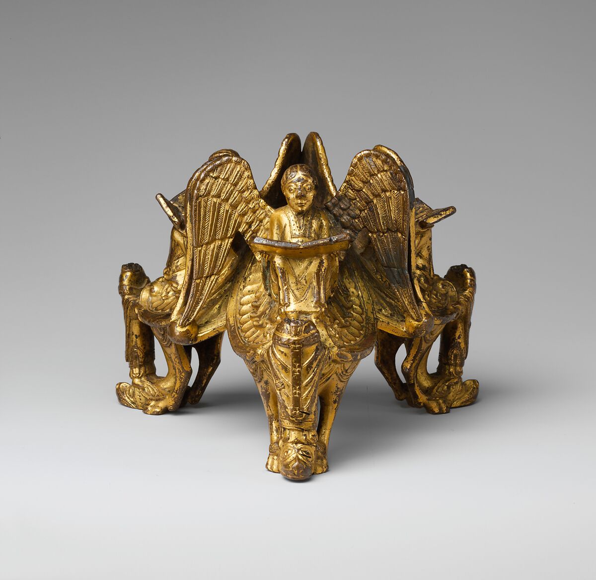 Base of an Altar Cross with Reading Angels Sitting on Dragons and Standing Church Fathers, Copper alloy, cast and gilt, North Italian 