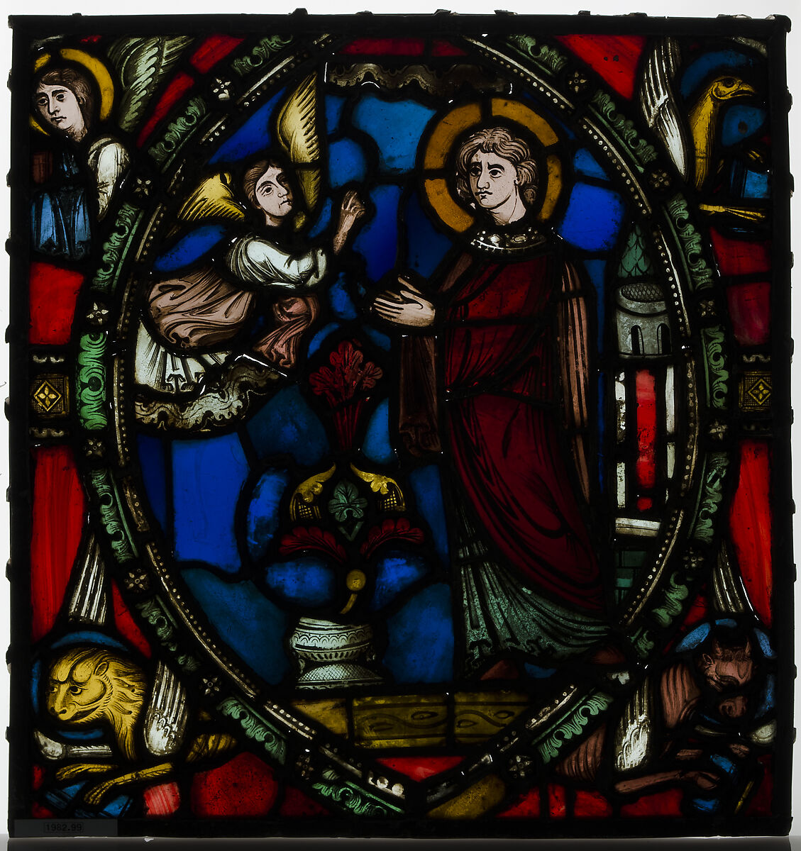 Stained glass fragment with an Angel Appearing to a Deacon Saint with the Symbols of the Four Evangelists, Stained glass, French 