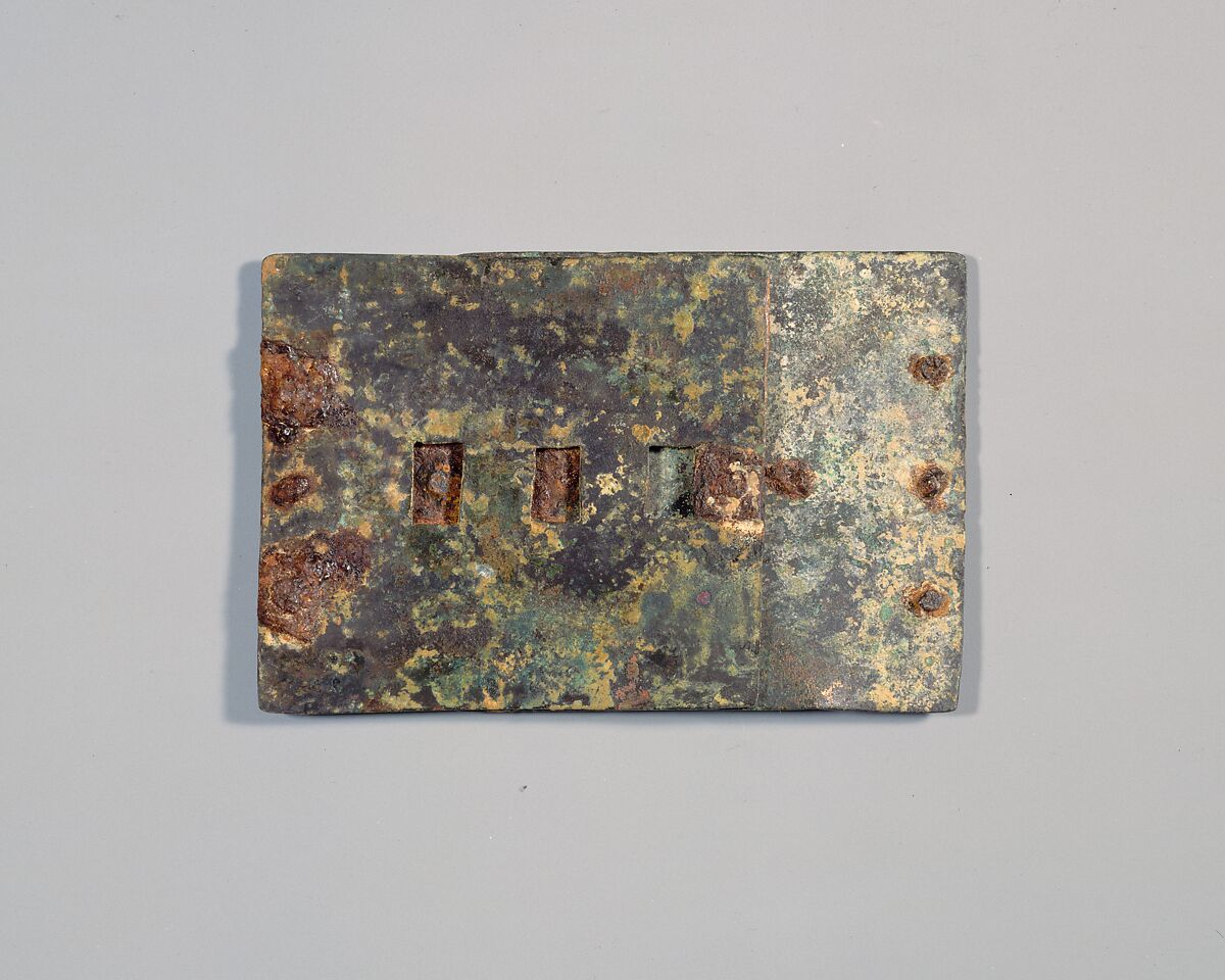 Belt Clasp, Leaded bronze, inlaid silver, iron rivets, Celtic