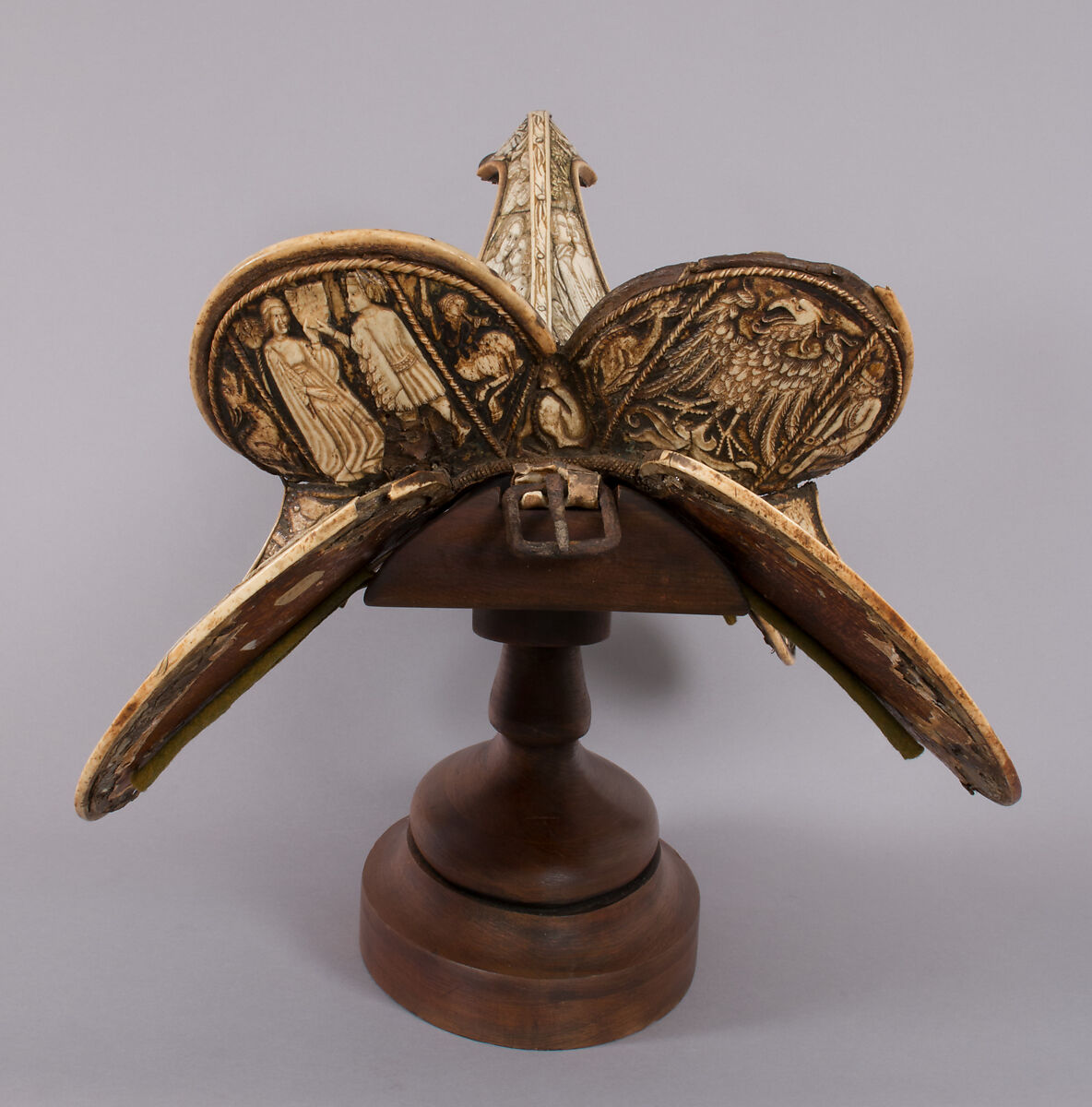 Saddle, Bovine bone (body of saddle), deer antler and bone (decorative elements), limewood, rawhide, birchbark, and metal paint, Central European