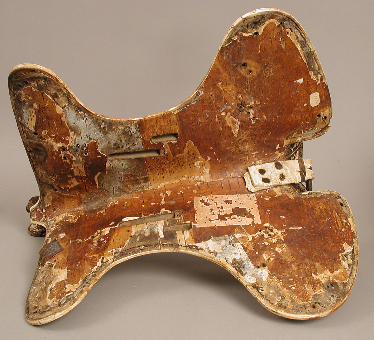 Saddle, Bovine bone (body of saddle), deer antler and bone (decorative elements), limewood, rawhide, birchbark, and metal paint, Central European