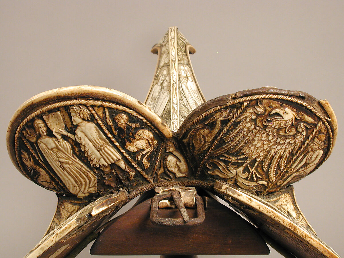 Saddle, Bovine bone (body of saddle), deer antler and bone (decorative elements), limewood, rawhide, birchbark, and metal paint, Central European