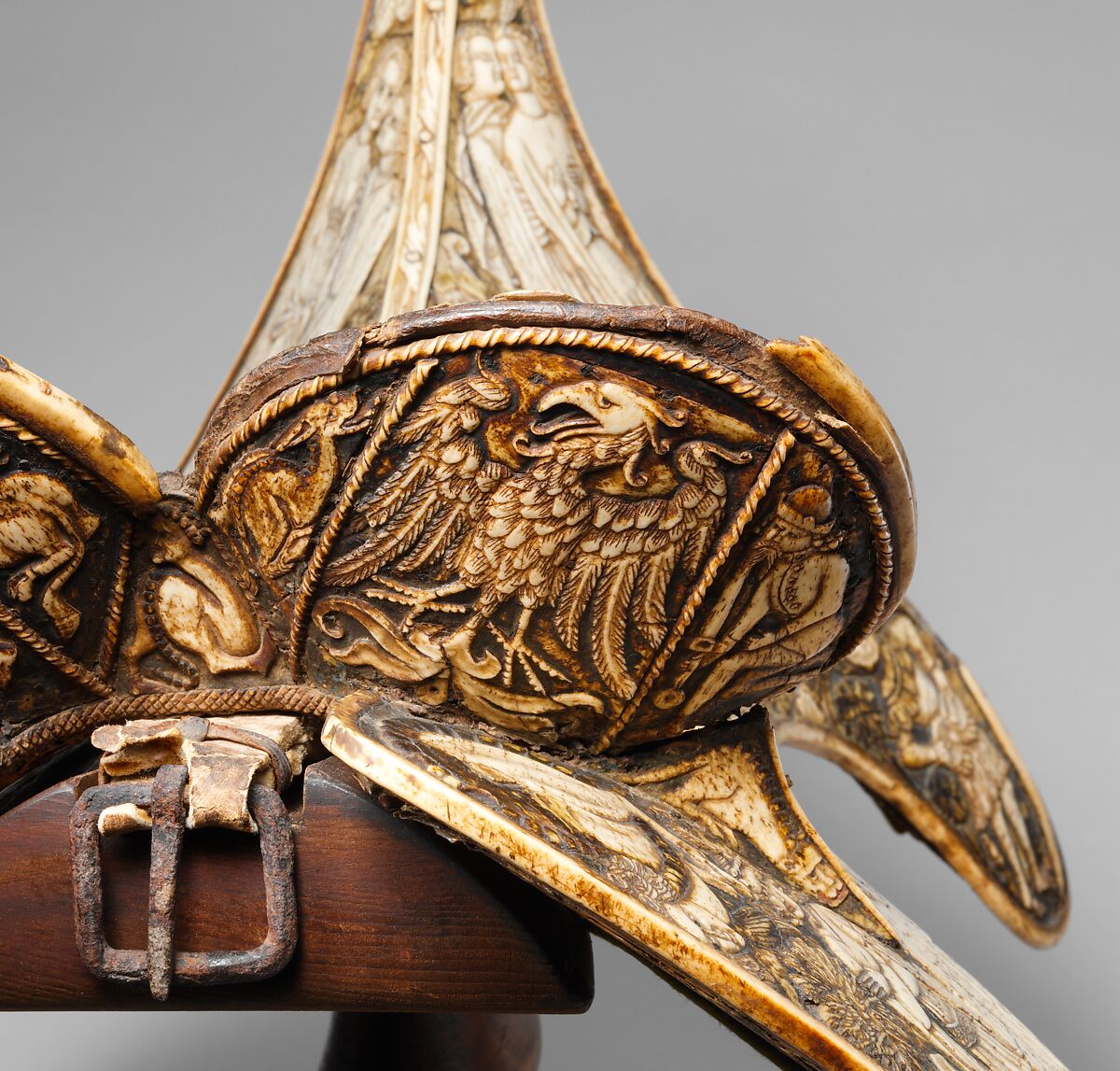 Saddle, Bovine bone (body of saddle), deer antler and bone (decorative elements), limewood, rawhide, birchbark, and metal paint, Central European