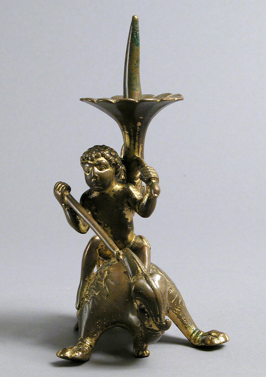 Pricket Candlestick with a Naked Youth Fighting a Dragon, Gilded copper alloy, South Netherlandish