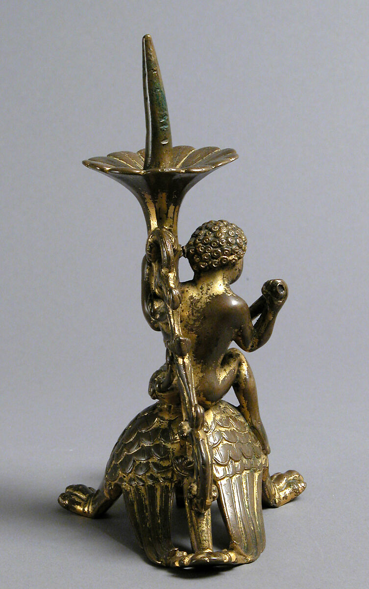 Pricket Candlestick with a Naked Youth Fighting a Dragon, Gilded copper alloy, South Netherlandish