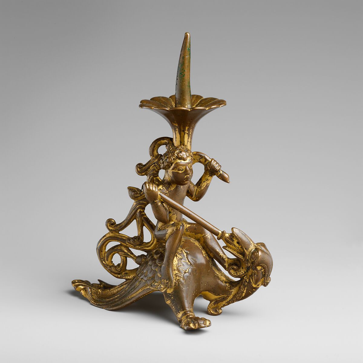 Pricket Candlestick with a Naked Youth Fighting a Dragon, Gilded copper alloy, South Netherlandish 