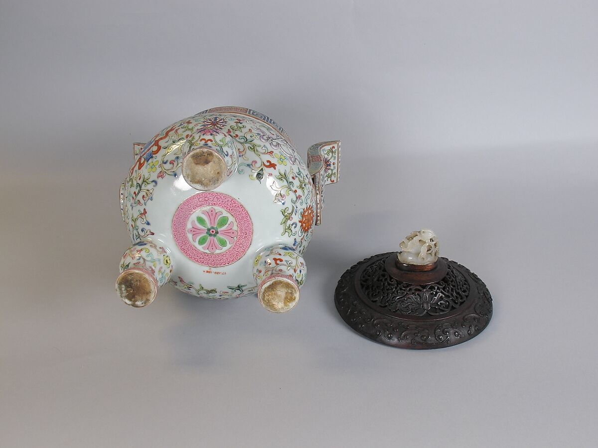 Tripod incense burner with Buddhist auspicious symbols, Porcelain painted in overglaze polychrome enamels (Jingdezhen ware), wooden cover with jade knob, China