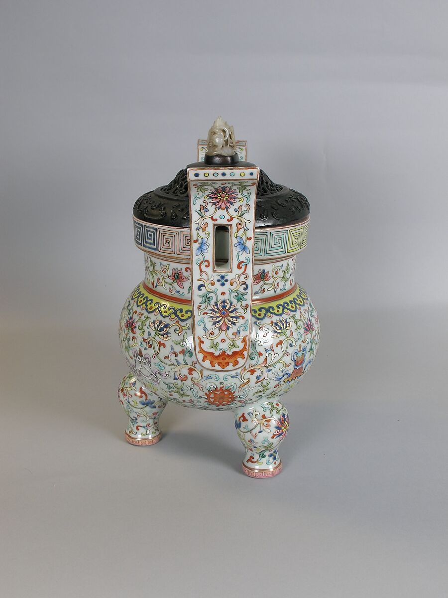 Tripod incense burner with Buddhist auspicious symbols, Porcelain painted in overglaze polychrome enamels (Jingdezhen ware), wooden cover with jade knob, China