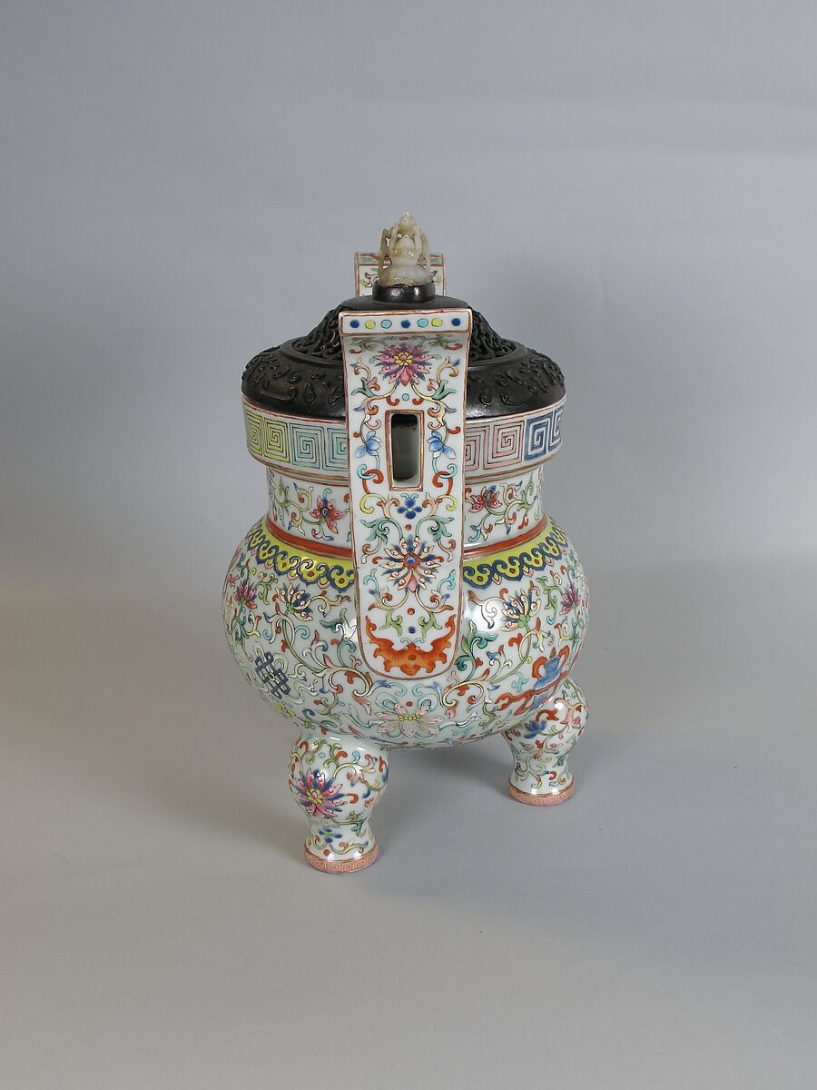 Tripod incense burner with Buddhist auspicious symbols, Porcelain painted in overglaze polychrome enamels (Jingdezhen ware), wooden cover with jade knob, China