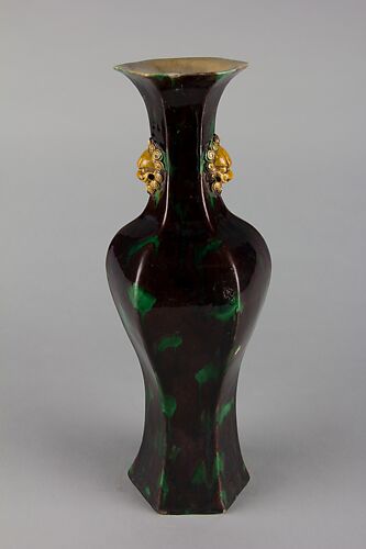 Hexagonal vase with lion-head handles